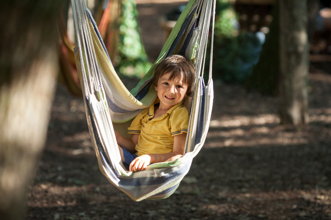 Laughing child in hammock