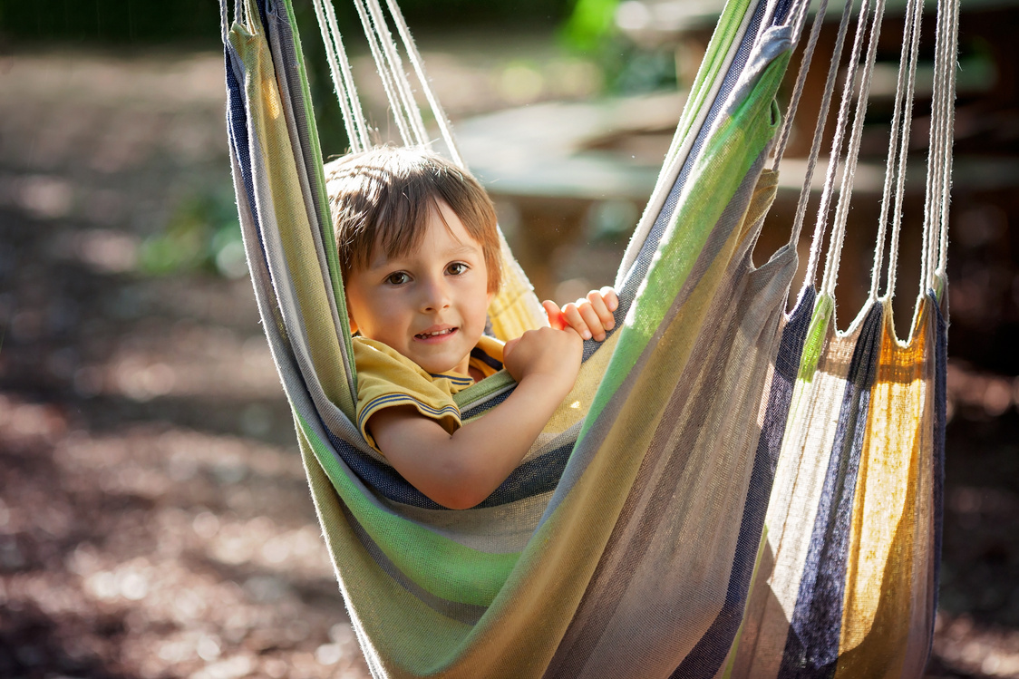 Laughing child in hammock